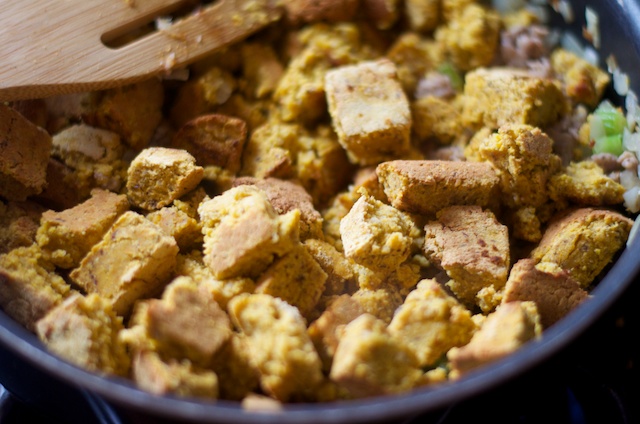 adding in cornbread to stuffing